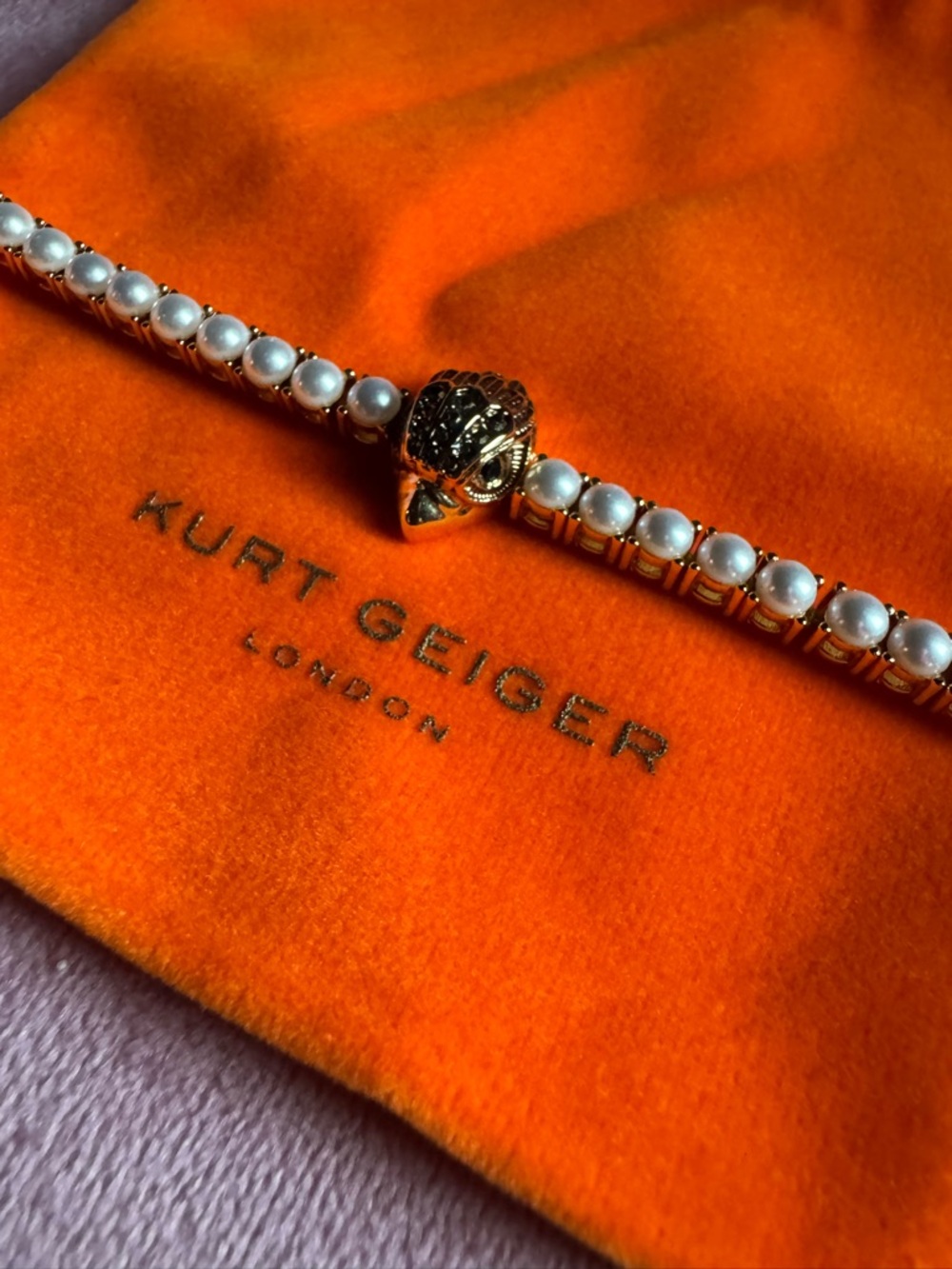 Kurt Geiger Gold Pearl  Bracelet with Lion Head Accent